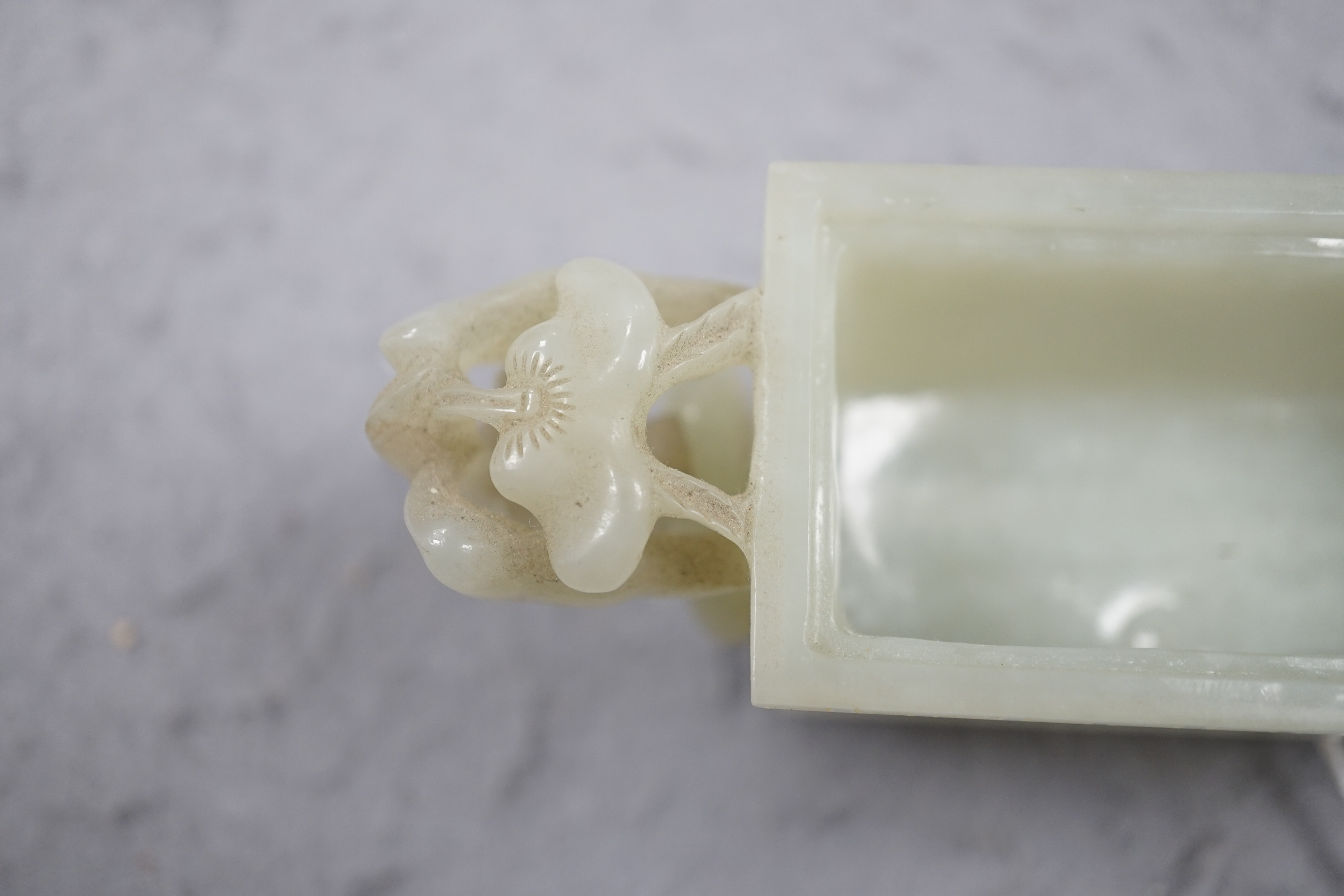 A Chinese pale celadon jade rectangular vase and cover, 19th/20th century